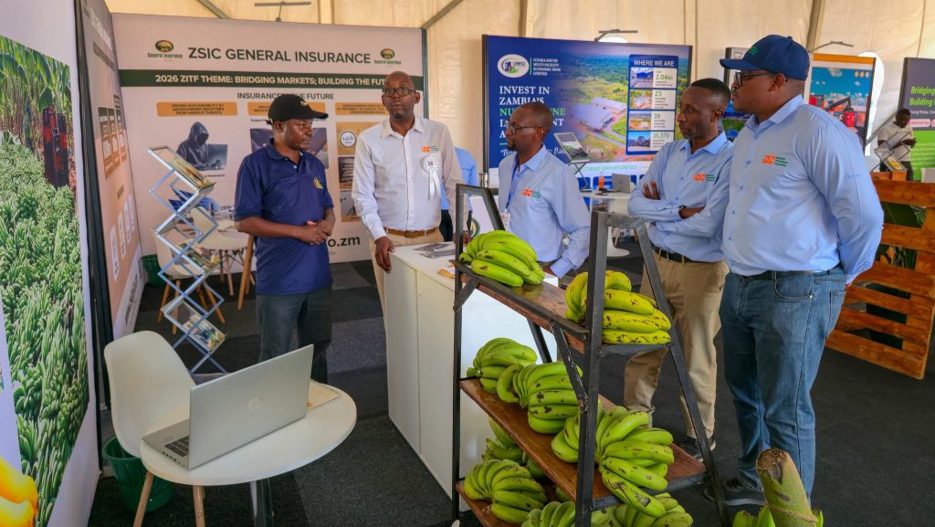 Visitors view portfolio company products displayed at the IDC pavilion.