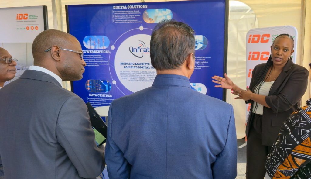 Visitors engage with an IDC portfolio company representative at the 60th Zambia International Trade Fair.