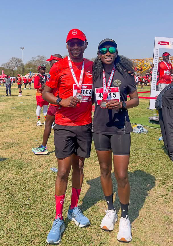 Team IDC participants with their medals at the 2026 ABSA Marathon