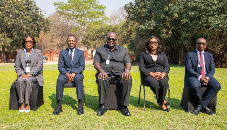 IDC Group leadership seated outdoors at Chaminuka Resort during the Company Secretaries Conference