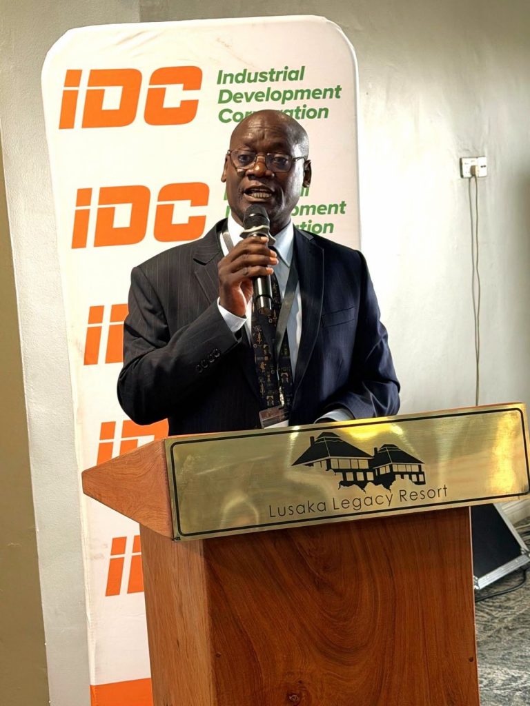 A man speaks from the lectern at the audit and risk management conference.