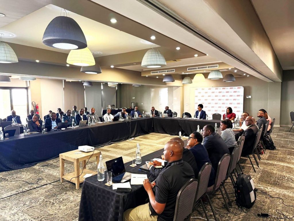 Delegates attend the audit and risk management conference in a hotel meeting room.