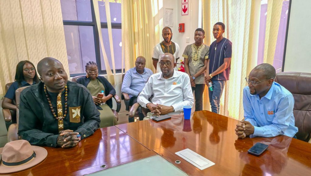 Staff in traditional and IDC attire attend the Independence celebration at IDC offices.