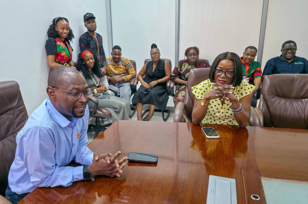 IDC staff members smile during the celebration of Zambia's 62nd Independence anniversary.