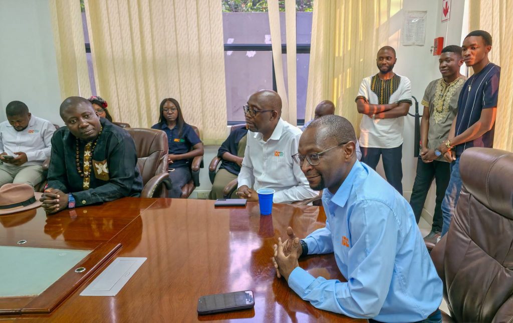 IDC management and staff share a light moment during the Independence anniversary event.