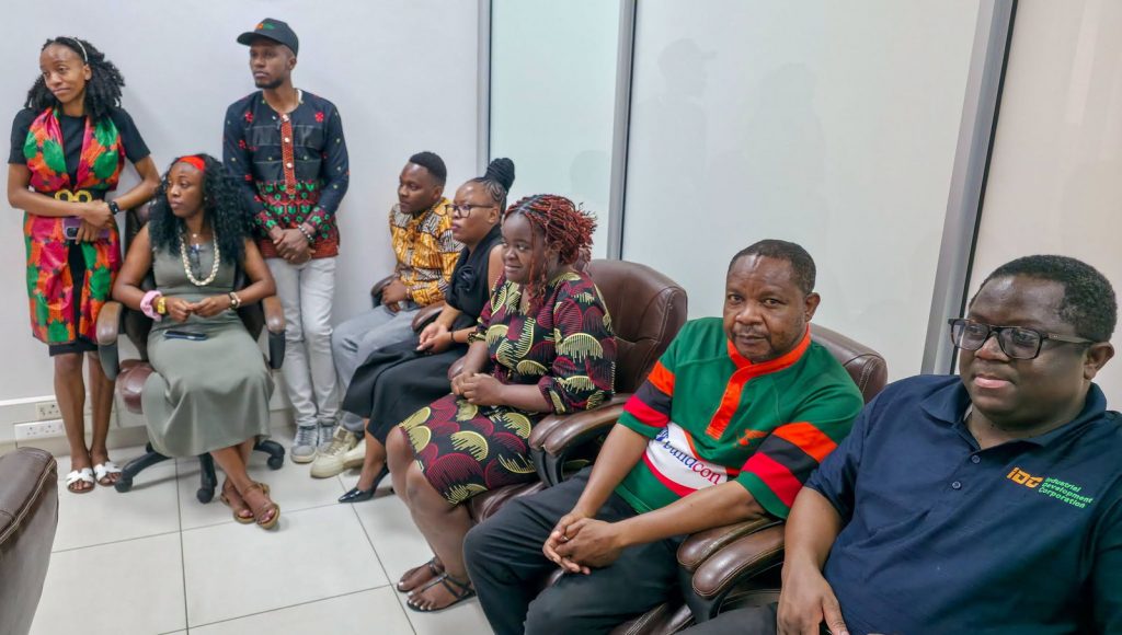 IDC staff dressed in Zambian national colours attend the Independence celebration.