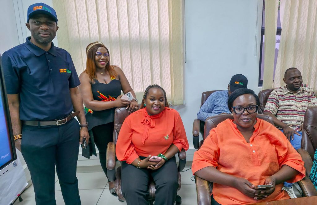IDC staff pose together at the end of the Independence anniversary celebration.