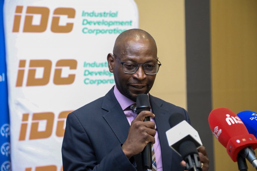 A representative speaks to the media at the MICC dividend handover
