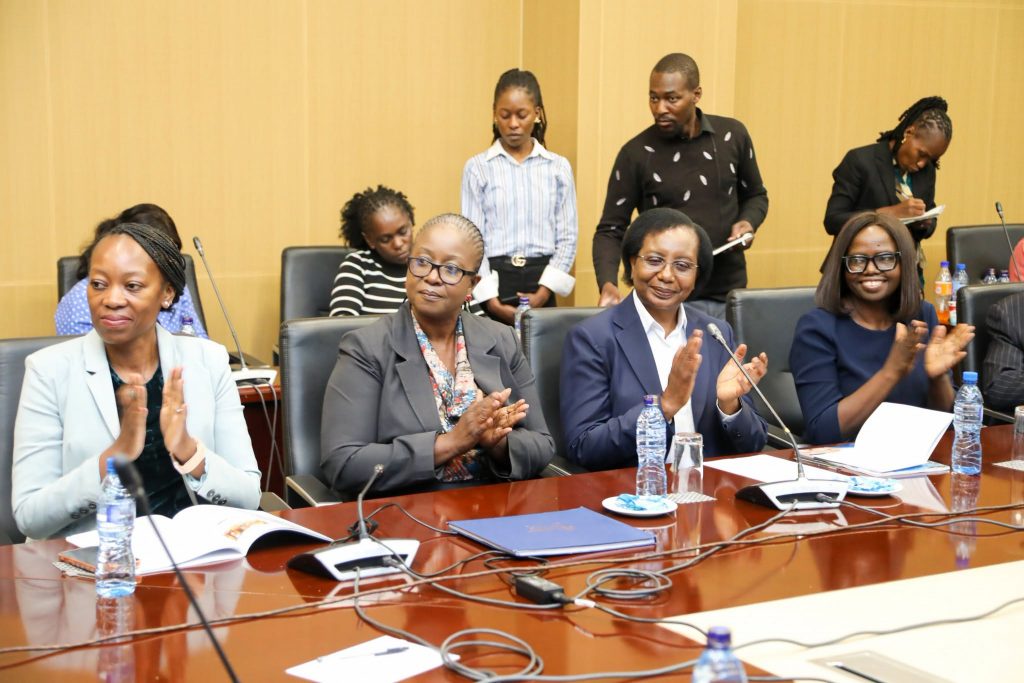 Delegates applaud during the MICC dividend handover ceremony