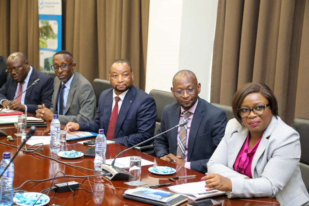 Delegates seated around the conference table at the MICC dividend handover