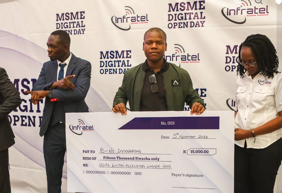 An MSME Digital Acceleration winner holds an award cheque at INFRATEL’s 2025 MSME Digital Open Day.